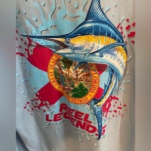 New with tags Reel Legends long sleeved shirt with state of Florida flag.